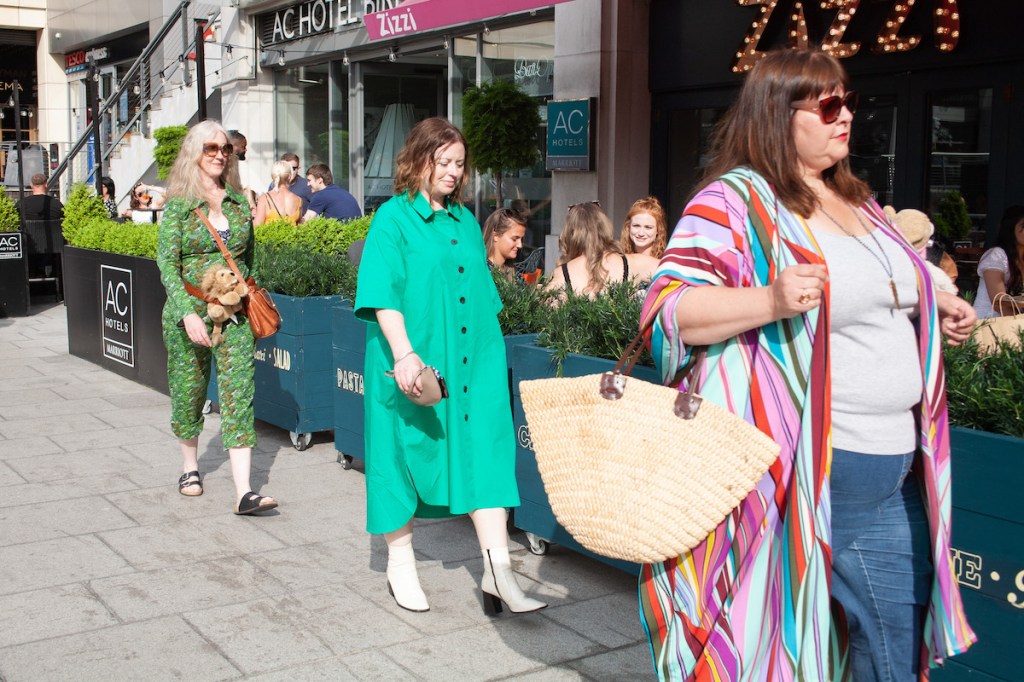 Three crones walk past Mailbox Birmingham