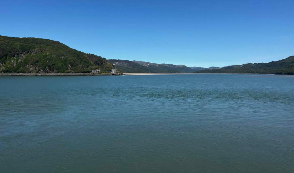 A sweeping sea view of an estuary on a sunny day